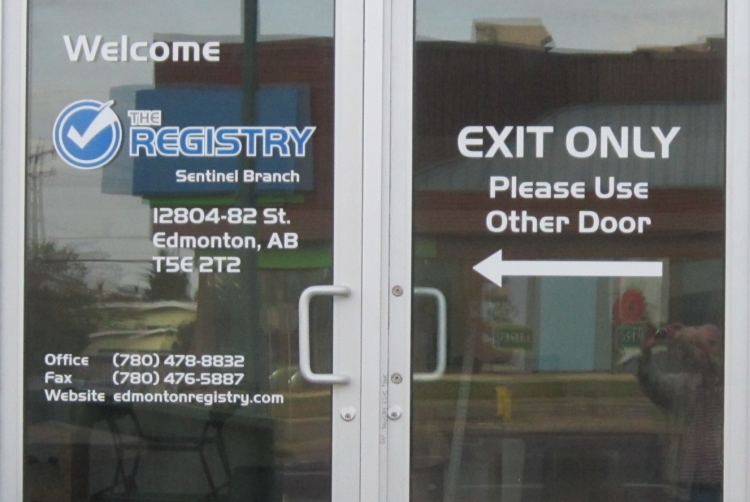On-site vinyl lettering and door graphics installation performed in the Edmonton area