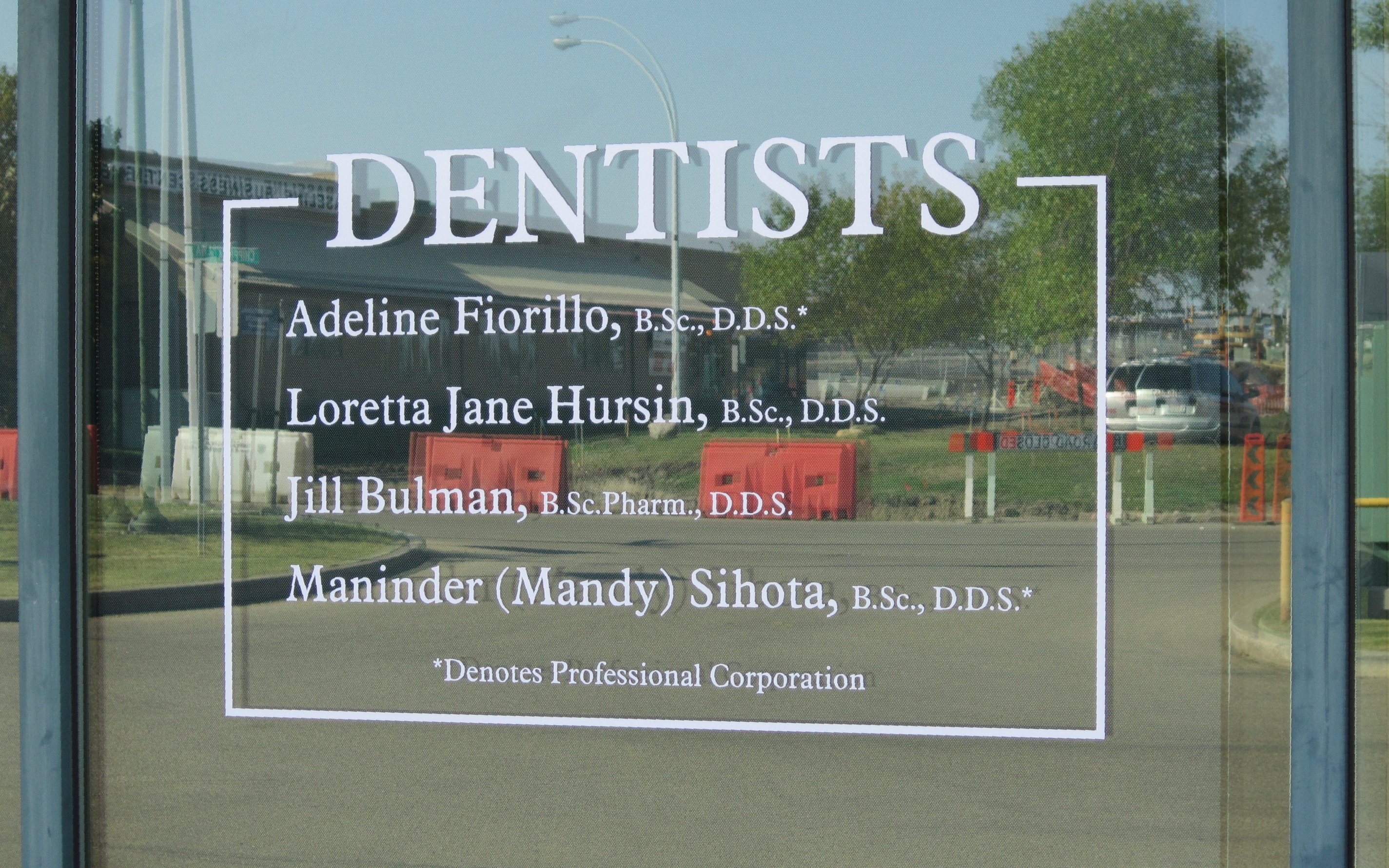 Professional dental office window lettering and door graphics on Chippewa Road, Sherwood Park